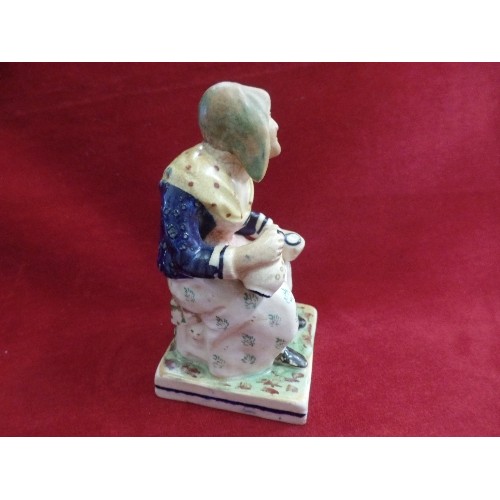 8 - A STAFFORDSHIRE EARTHENWARE FIGURE OF DOLLY PENTREATH ON A SQUARE BASE - MARKED 1753 TO BACK. SAID T... 