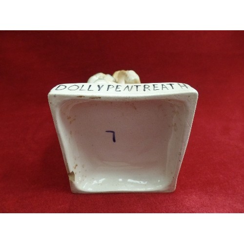 8 - A STAFFORDSHIRE EARTHENWARE FIGURE OF DOLLY PENTREATH ON A SQUARE BASE - MARKED 1753 TO BACK. SAID T... 