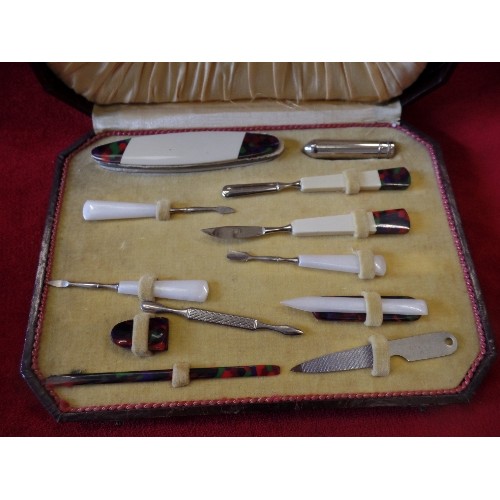 41 - AN ART DECO CASED MANICURE SET WITH COLOURED BAKELITE TOOLS