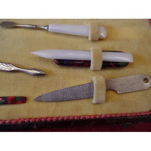 41 - AN ART DECO CASED MANICURE SET WITH COLOURED BAKELITE TOOLS