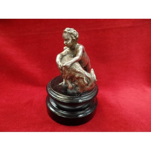 72 - A 19TH CENTURY SILVER PLATED FIGURE OF A CHERUB WRESTLING A GOAT IN THE CLASSICAL STYLE - ON AN EBON... 