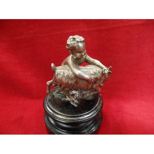 72 - A 19TH CENTURY SILVER PLATED FIGURE OF A CHERUB WRESTLING A GOAT IN THE CLASSICAL STYLE - ON AN EBON... 