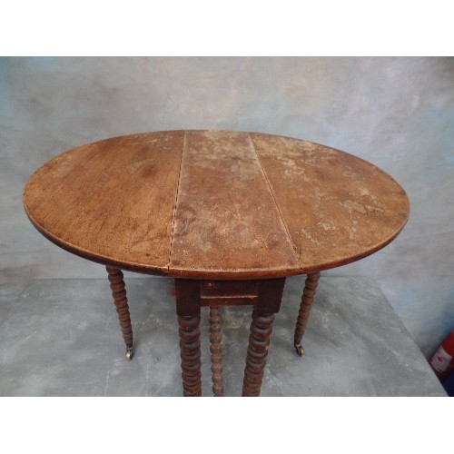 103 - A VICTORIAN MAHOGANY SUTHERLAND TABLE WITH BOBBIN TURNED LEGS AND STRETCHER - ORIGINAL BRASS CASTORS