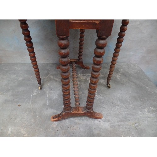 103 - A VICTORIAN MAHOGANY SUTHERLAND TABLE WITH BOBBIN TURNED LEGS AND STRETCHER - ORIGINAL BRASS CASTORS