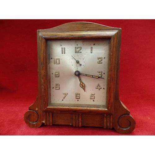 201 - AN ART DECO OAK CASED ALARM CLOCK - LUMINOUS HANDS AND NUMERALS - ALADDIN LAMP MAKERS MARK TO THE SI... 