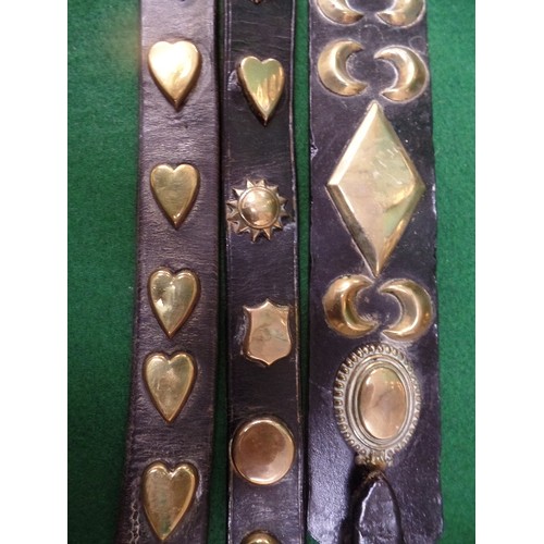 301 - THREE 19TH CENTURY HARNESS STRAPS WITH STUDS - HEARTS / MOONS / DIAMONDS / SHIELDS, ONE WITH CHAIN