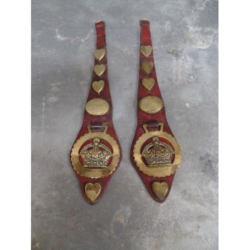 311 - A GOOD PAIR OF RED LEATHER HARNESS STRAPS WITH HEART AND OVAL STUDS AND STAMPED CROWN BRASSES (PROBA... 