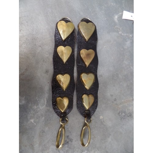 317 - A PAIR OF VICTORIAN LEATHER HARNESS STRAPS WITH LARGE HEART STUDS AND TWO FURTHER 19TH CENTURY STRAP... 