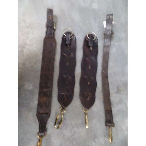 317 - A PAIR OF VICTORIAN LEATHER HARNESS STRAPS WITH LARGE HEART STUDS AND TWO FURTHER 19TH CENTURY STRAP... 