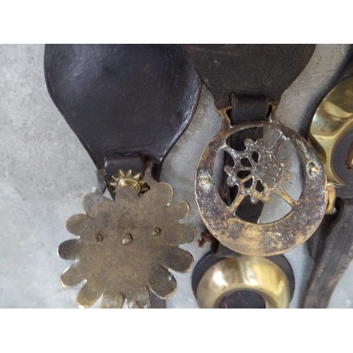 321 - FOUR VICTORIAN FACE PIECE STRAPS INCLUDING AN UNUSUAL AND EARLY CONVEX STAMPED BRASS WITH A 12 POINT... 