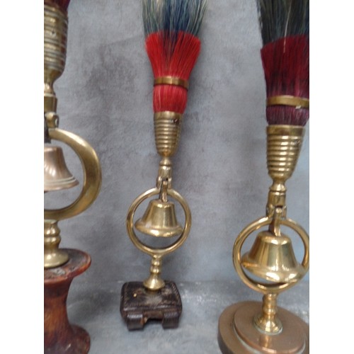 360 - THREE ANTIQUE SINGLE BELL TERRETS WITH RED, WHITE  & BLUE PLUMES, ONE MOUNTED ON ORIGINAL LEATHER FI... 