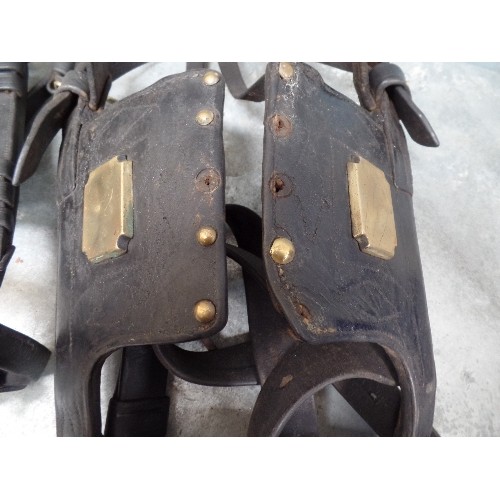 399 - TWO ANTIQUE LEATHER BRIDLES WITH BRASS STUDS TO THE BLINKERS, ONE WITH STUDDED BROWBAND, ONE WITH IR... 