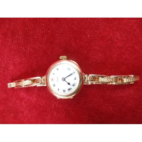 66 - A VINTAGE LADIES 9CT GOLD SWISS WRIST WATCH BY LIMIT, WITH ENAMELLED DIAL - WORKS, THEN STOPS. ON A ... 