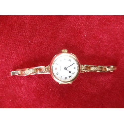 66 - A VINTAGE LADIES 9CT GOLD SWISS WRIST WATCH BY LIMIT, WITH ENAMELLED DIAL - WORKS, THEN STOPS. ON A ... 