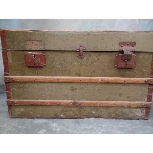 122 - AN ANTIQUE WOOD AND METAL BOUND CHEST - ORIGINAL GREEN PAPER COVERING SIMULATING LEATHER