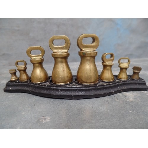 50 - A SET OF SALTERS BRASS WEIGHTS ON A STAND