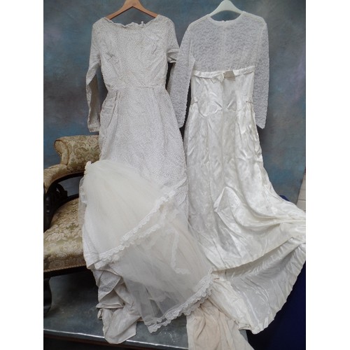 26B - TWO VINTAGE WEDDING DRESSES, ONE FROM THE 1950'S, THE OTHER FROM THE 60'S AND A VINTAGE SHORT VEIL