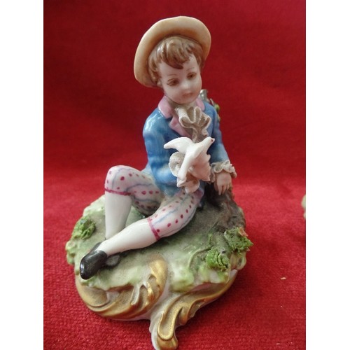 76 - PAIR OF REGENCY STYLE GIRL AND BOY FIGURES, BOY HOLDING A DOVE AND GIRL A BOUQUET.  DAMAGE TO GIRL'S... 