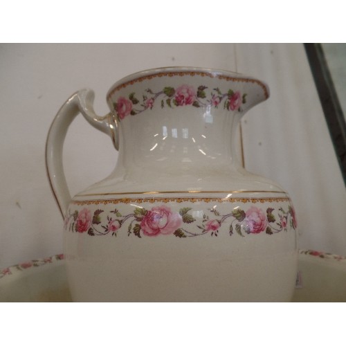 114 - WASH JUG AND BOWL SET, WHIE WIH PINK ROSE EDGING.  LARGE NIBBLE OUT OF THE BOWL
