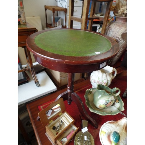 132 - CIRCULAR WINE TABLE, ON PEDESTAL BASE. WITH GREEN TOOLED 'LEATHER' TOP.