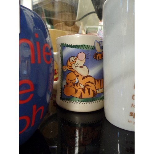 215 - COLLECTION OF 9 X DISNEY TIGGER & WINNIE THE POOH MUGS.