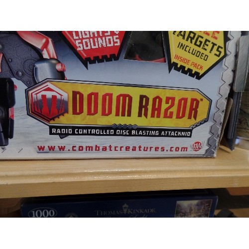 245 - 2 x DOOM RAZOR RADIO-CONTROLLED DISC BLASTERS. FIRE POWA DISCS UP TO 9 METRES.