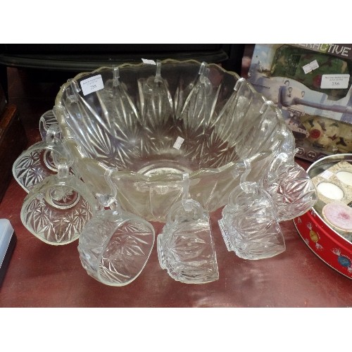 258 - RETRO-VINTAGE PUNCH BOWL SURROUNDED BY 12 GLASS HANGING PUNCH CUPS.