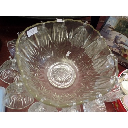 258 - RETRO-VINTAGE PUNCH BOWL SURROUNDED BY 12 GLASS HANGING PUNCH CUPS.