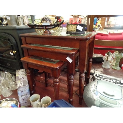 260 - NEST OF 3 TABLES. DARK POLISHED WOOD WITH BEVELLED GLASS TOPS.