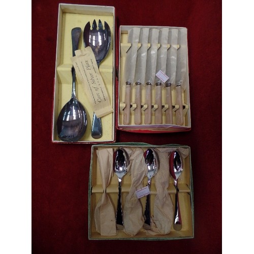 283 - 3 VINTAGE BOXED CUTLERY SETS. INCLUDES BUTTER KNIVES, TEASPOONS, AND SERVING SPOONS.