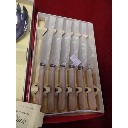 283 - 3 VINTAGE BOXED CUTLERY SETS. INCLUDES BUTTER KNIVES, TEASPOONS, AND SERVING SPOONS.