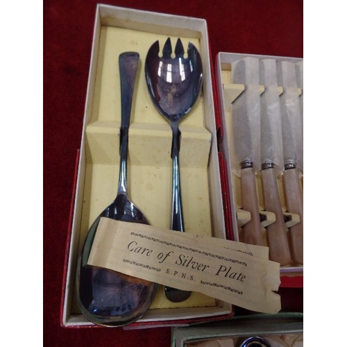 283 - 3 VINTAGE BOXED CUTLERY SETS. INCLUDES BUTTER KNIVES, TEASPOONS, AND SERVING SPOONS.