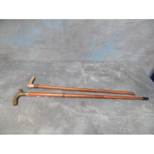 85 - 2 X WALKING STICKS, ONE WITH BONE HANDLE AND ONE WITH BRASS HANDLE AND HIDDEN FLASK