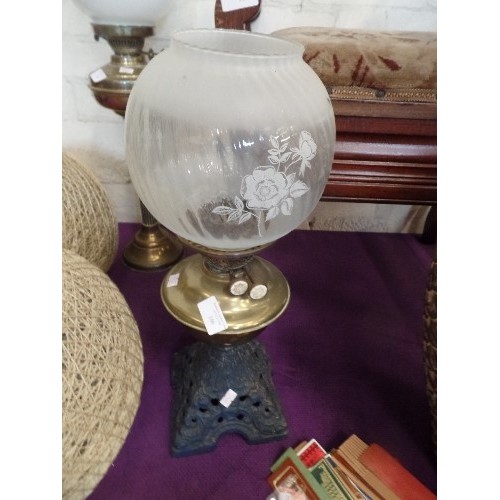 166 - LARGE OIL LAMP, WITH METAL BASE, BRASS RESERVOIR AND GLASS GLOBE.