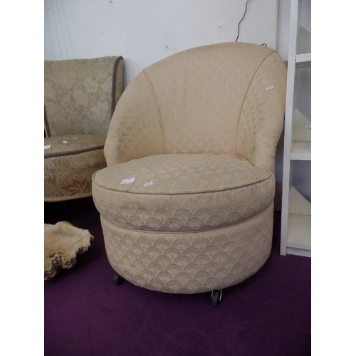 96 - A BEDROOM TUB CHAIR WITH SHELL DESIGN UPHOLSTERY ON BAKELITE CASTERS