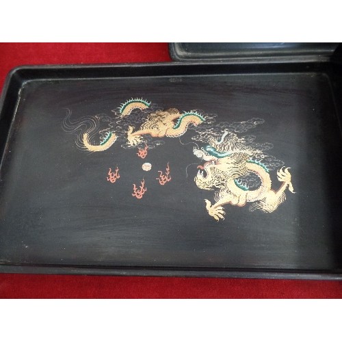 238 - 3 X SMALL ORIENTAL LAQUERED TRAYS. HAND-PAINTED WITH CHINESE DRAGONS.