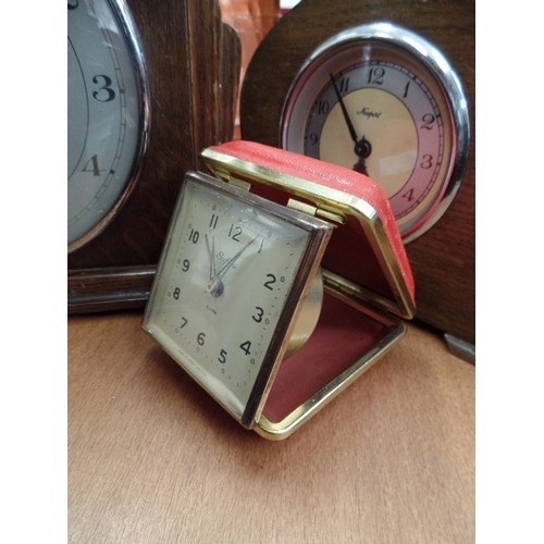 242 - 2 OAK CASED ART DECO MANTLE CLOCKS. 1 BY NEWPORT, BOTH MADE IN ENGLAND. ALSO A SAFARI TRAVEL ALARM C... 