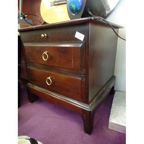 129 - STAG MINSTREL  BEDSIDE CABINET. 2 DRAWER, AND A PULL-OUT FLAT SURFACE.