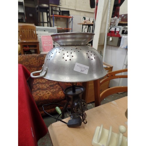 207 - NOVELTY LAMP MADE FROM VINTAGE MINCER, WITH AN ALUMINIUM COLANDER SHADE. WITH BENCH CLAMP.