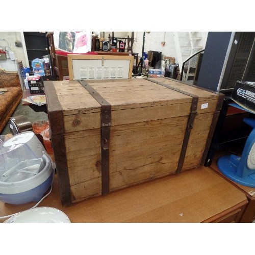 247 - VINTAGE RUSTIC WOODEN CHEST, WITH HEAVY IRON BANDS, HANDLES AND EDGES.