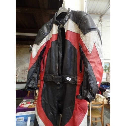 345 - LEATHER TEKNIC MOTORCYCLE SUIT. ALL-IN-ONE, AND UNZIPS  TO SEPARATE JACKET FROM TROUSERS. BLACK RED ... 