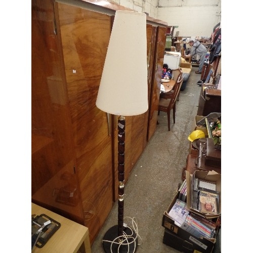 361 - POLISHED MAHOGANY/BRASS STANDARD LAMP. TURNED DETAIL. SLIM CONE SHADE IN IVORY.