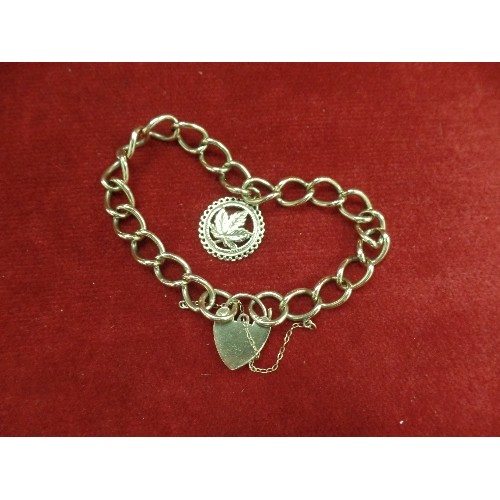 18 - 9ct GOLD CHARM BRACELET WITH HEART PADLOCK, CANADIAN CHARM AND SAFETY CHAIN WEIGHT 21.30GR