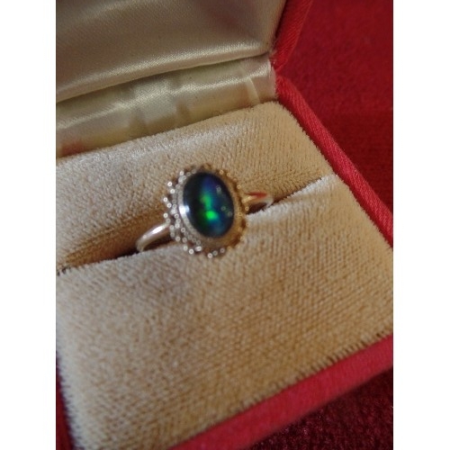 29 - A 9ct GOLD RING WITH FIRE OPAL WITH MULTITUDE OF COLOURS VERY GOOD STONE SIZE N  WEIGHT 1.58gr