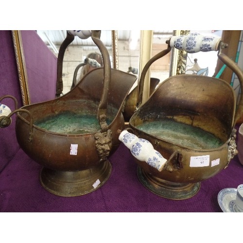 95 - PAIR OF VINTAGE BRASS COAL SCUTTLES, WITH LIONS HEAD & BLUE/WHITE CERAMIC HANDLES.