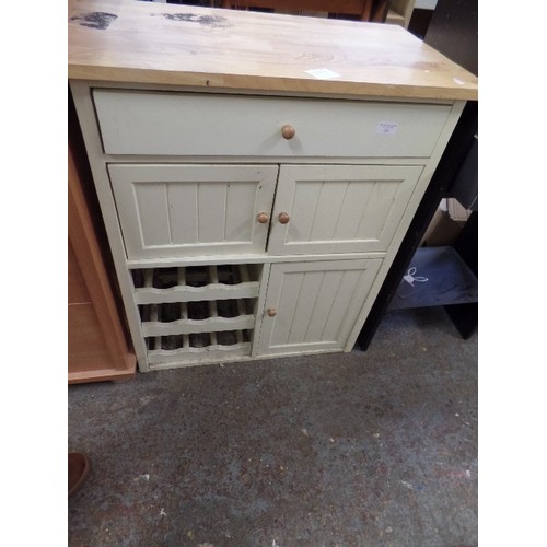 241 - SMALL CREAM PAINTED KITCHEN UNIT WITH SMALL INCORPORATED WINE RACK. BEECH TOP.