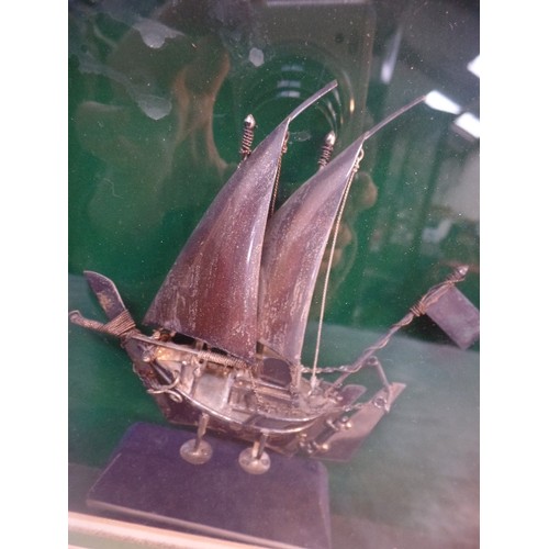 23 - A MIDDLE EASTERN SILVER MODEL OF A DHOW OR BGHLAH SAILING BOAT - PROBABLY FROM OMAN, LATE 20TH CENTU... 