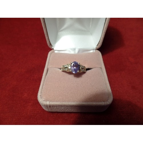 65 - A RENAISSANCE STYLE 14CT GOLD RING WITH OVAL CUT TANZANITE AND THE SHOULDERS SET WITH 22 DIAMONDS - ... 