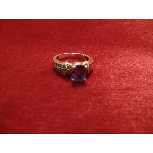 65 - A RENAISSANCE STYLE 14CT GOLD RING WITH OVAL CUT TANZANITE AND THE SHOULDERS SET WITH 22 DIAMONDS - ... 