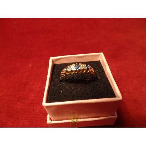 69 - AN ANTIQUE 18CT GOLD RING SET WITH THREE GRADUATED SAPPHIRES AND DIAMONDS - 2.7 GRAMS